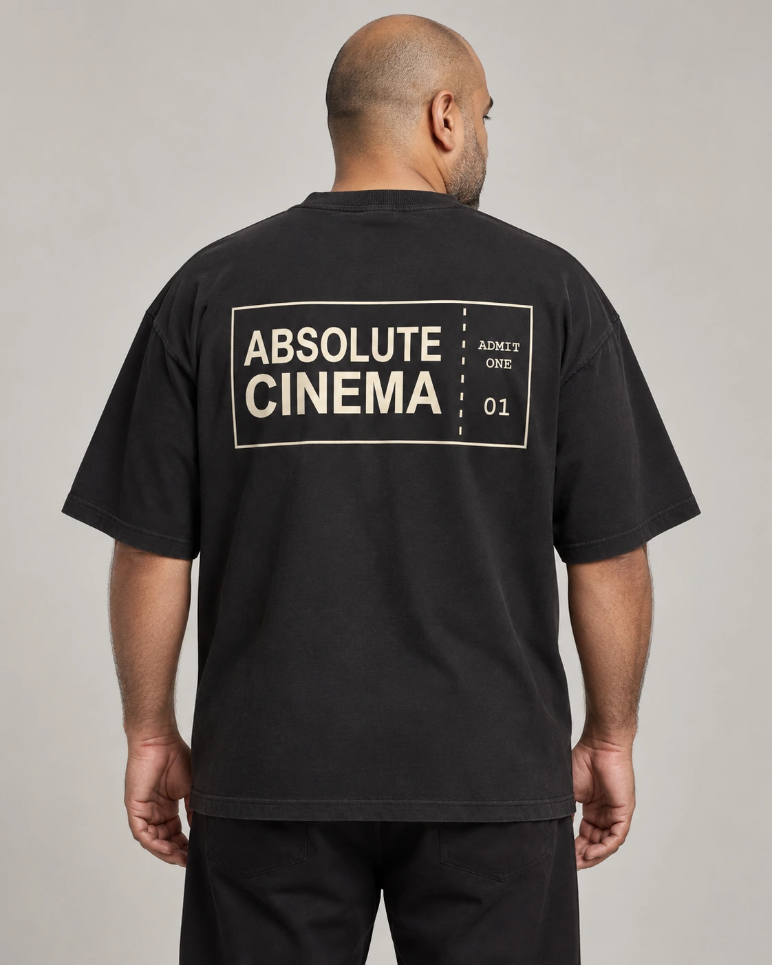 Absolute Cinema in Washed Black, unisex oversized tee, back view